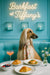 Afghan Hound in floral scarf on teal banquette with croissants, eggs benedict, berries, cocktail & neon sign – Barkfast at Tiffany’s metal print