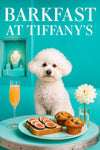 Fluffy Bichon Frise seated on Tiffany-blue banquette with fig-topped toast, blueberry muffins, a peach cocktail flute, white flower, and jewelry display