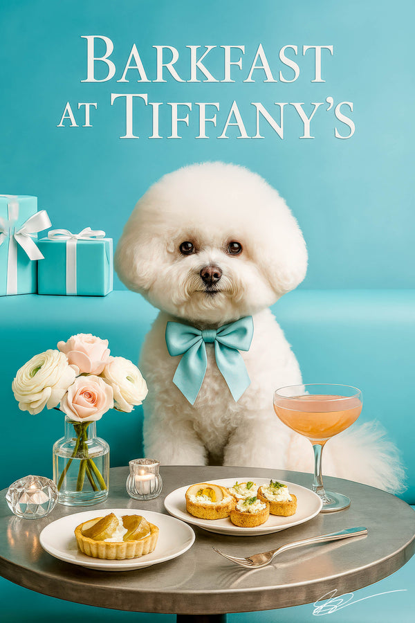 Fluffy Bichon Frise wearing a Tiffany-blue bow tie seated on a turquoise banquette with a plate of mini cream tarts, a pear tart, a cocktail, flowers, and candleholders
