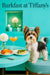 Biewer Terrier with a turquoise bow standing beside a Tiffany-blue table set with apricot-topped toast, a spinach quiche tart, a peach cocktail, and a white flower in a vase