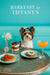 Biewer Terrier standing on a turquoise banquette behind a table with a berry parfait, tomato-topped toast, ricotta-topped toast, and a peach cocktail