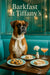 Refined Boxer in an ivory scarf at a wood table set with blueberry scones, finger sandwiches, a white carnation and a peach-hued cocktail under “Barkfast at Tiffany’s” sign