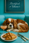 Cavalier King Charles Spaniel on turquoise bench with croissants and cocktail coupe under framed Barkfast at Tiffany’s constellations sign