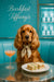 Golden cocker spaniel wearing floral scarf seated at turquoise booth with cocktail and crustless tea sandwiches