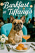 Fawn French bulldog wearing a floral scarf seated at a white tablecloth café table with pastries white roses utensils and a cocktail metal print