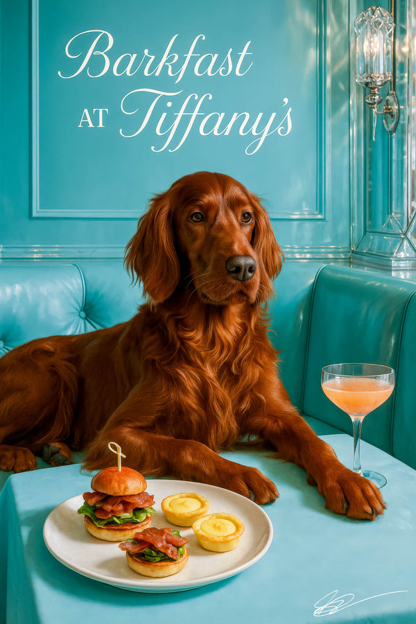 Auburn Irish Setter reclining on teal banquette beside plate of bacon lettuce sliders lemon tarts and a pink cocktail