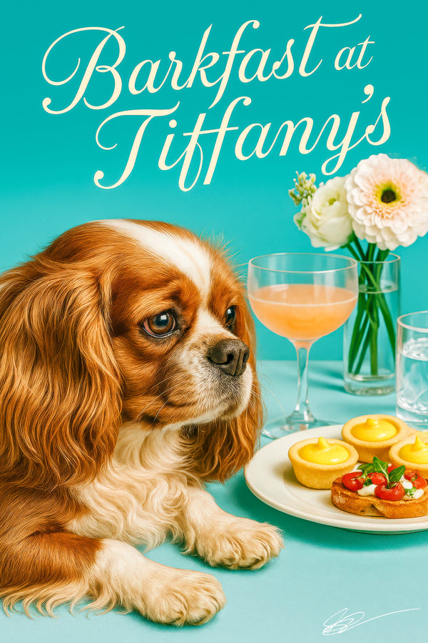 King Charles Cavalier with chestnut-and-white coat seated on a teal banquette beside a bud vase of ivory blooms under soft window light