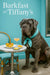 Grey Neapolitan Mastiff wearing a Tiffany-blue scarf seated beside a marble bistro table under a glowing Barkfast at Tiffany’s sign