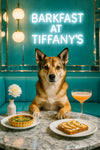 Norwegian Lundehund leaning forward with paws on a marble table set with a spinach quiche, pear-topped toast, a peach brunch cocktail and a white dahlia vase under a Barkfast at Tiffanys sign