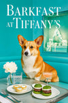 Pembroke Welsh Corgi seated on a teal banquette beside a metal café table with three mini quiches spinach slider buns a pink cocktail and white flowers