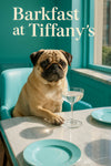 Pug sitting at a turquoise café table with a coupe glass and matching plates in bright sunlight