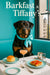Rottweiler wearing a turquoise scarf seated on a Tiffany blue banquette beside a large window overlooking a city street