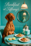 Vizsla seated on a turquoise banquette beside a Tiffany-blue gift box under a neon Barkfast at Tiffany’s sign
