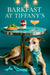 Whippet wearing a turquoise scarf lying under a round metal table topped with arugula toast a berry parfait and a peach cocktail against a teal background with hanging globe lights