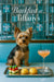 Yorkshire terrier seated on a teal banquette behind a metal tray with mozzarella tomato basil skewers two cheese scones and a peach cocktail under a grid of blue gift boxes