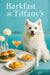 American Eskimo Dog seated beneath a crystal chandelier at a Tiffany-blue café table with mini spinach quiches, a berry & granola parfait, and a peach cocktail against a mirrored wall