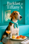 American Foxhound wearing a Tiffany-blue scarf seated at a café table with a cornbread muffin, tomato tartlets, and a peach cocktail