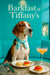 American Foxhound wearing a Tiffany-blue scarf seated at a café table with goat cheese tartlet, tomato & basil tartlet, and a peach cocktail
