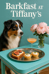 Australian Shepherd wearing a Tiffany-blue scarf seated at a café table with fig-topped ricotta toast, ricotta tartlets, a peach cocktail, and a pink peony by a sunlit window