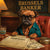 Brussels Griffon dressed as banker reviewing investment papers and drink