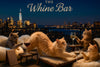 Four cats at a rooftop lounge sipping white and red wine glasses under a “The Whine Bar” sign on a Metal Print