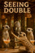 Three meerkats at a safari lodge bar with peach cocktails, one reaching toward a tribal mask reflected in a mirror under woven pendant lights