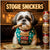 shih tzu in treat-patterned bib holding a lit cigar beside stacked cans of pup-tonics and piles of dog currency