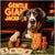 Great Dane seated at a poker table with stacks of red and yellow casino chips, dog-themed playing cards, and a neon "Gentle Giant Jackpots" sign glowing in the background.