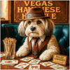 Havanese dog wearing a hat and vest seated at a table with bone-themed cards, a glass of rawhide cigars, and a sign labeled Vegas Havanese Hustle.