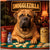 Mastiff dog at a poker table with gold chain, treats, and tiles in a cozy lounge labeled Snugglezilla.