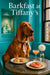 Bloodhound seated at a Tiffany-blue tufted banquette table with ham sandwich triangles, scones, butter dish, sugar bowl, and a peach cocktail