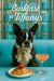 Tuxedo-masked Boston Terrier in a floral scarf on a turquoise banquette before Tiffany-blue gift boxes, with a croissant topped by a strawberry and a peach cocktail under “Barkfast at Tiffany’s” sign