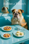 English Bulldog seated in a turquoise booth by a sunlit window with a table of tomato-quiche tart, cherry-topped puff, cucumber rounds and a peach-hued cocktail under “Barkfast at Tiffany’s” script