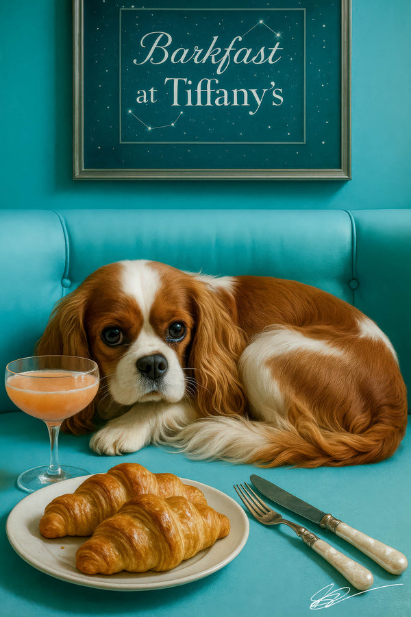 Cavalier King Charles Spaniel on turquoise bench with croissants and cocktail coupe under framed Barkfast at Tiffany’s constellations sign