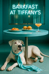 Dogo Argentino wearing turquoise scarf lying under a round Tiffany blue bistro table topped with smoked salmon tartine mini muffins peach cocktail under neon Barkfast at Tiffanys sign