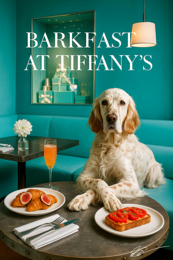 English setter seated on turquoise banquette with paws crossed on round table holding fig topped croissants tomato toast and peach cocktail with gift box display behind