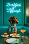 German Shorthaired Pointer wearing a teal scarf seated in a neon-lit banquette with a muffin, crab-cake sliders, and cocktail on a metal print