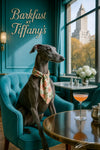 Greyhound wearing a floral scarf seated in a teal armchair at a round table with a pink cocktail silver sugar bowl and cityscape view