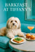 Fluffy Havanese dog on teal banquette next to arugula toast golden muffins and a pink cocktail