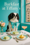 Black and white Japanese Chin wearing a teal bow tie seated at a teal banquette beside cucumber tea sandwiches lemon tart and a pink cocktail