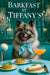 Fluffy Keeshond wearing a teal silk scarf sitting behind mini spinach quiches, whipped cheese toast, and a blush-pink cocktail on a turquoise table