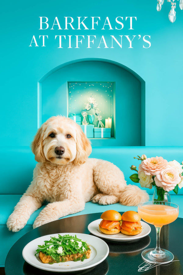 Cream Labradoodle reclining on a teal banquette with arugula toast, smoked-salmon sliders, a peach cocktail, and blush roses on a glossy table