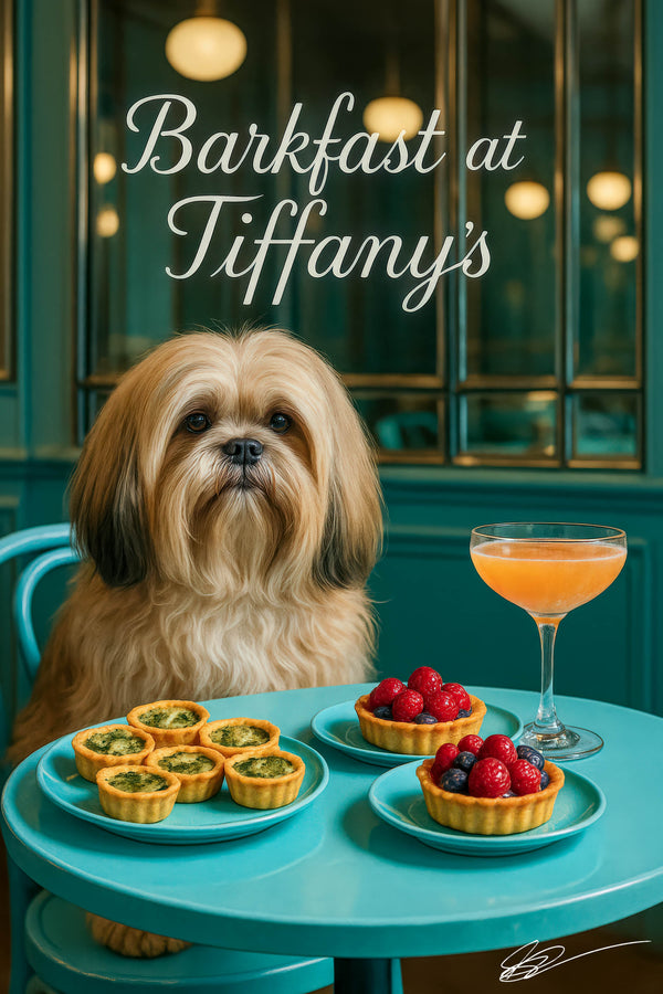 Fluffy golden Lhasa Apso seated at a round turquoise table with six mini spinach quiches two berry tarts and a peach cocktail under a Barkfast at Tiffanys sign
