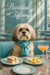 Silky Lhasa Apso wearing turquoise scarf seated at a round marble table with crustless tea sandwiches lemon tarts a peach cocktail and glass of water under Barkfast at Tiffanys sign and mirrored wall