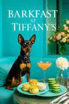 Black-and-tan Miniature Pinscher seated on a turquoise banquette with scones clotted cream cucumber stacks and a peach cocktail under a Barkfast at Tiffanys sign