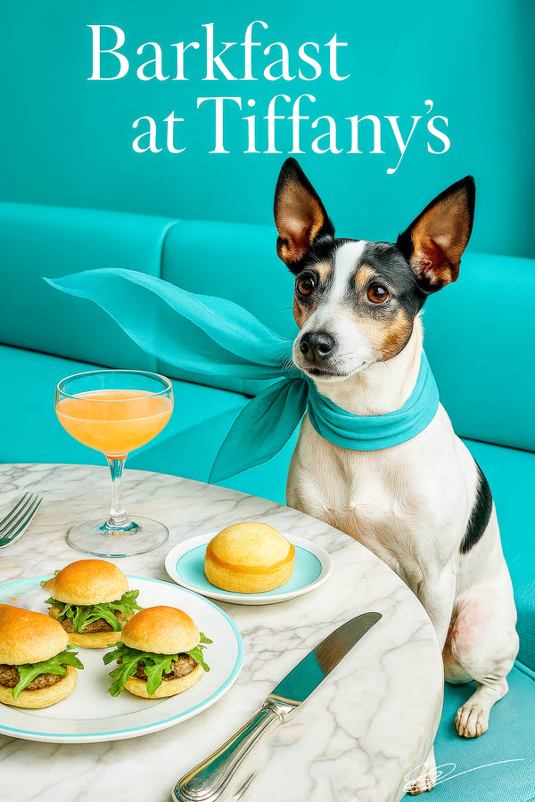 Rat Terrier wearing a turquoise scarf seated at a marble café table with three mini sliders a brioche bun top and a peach cocktail against a teal banquette