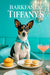 Rat Terrier wearing a turquoise scarf seated at a turquoise banquette by a metal café table with a muffin, two mini egg salad sliders, and a peach cocktail under a crystal chandelier