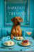 Regal Rhodesian Ridgeback seated on a turquoise banquette in a chic café setting, with a star-speckled silver mirror on the teal wall behind him