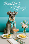 Whiskered Schnauzer wearing a turquoise scarf seated on a teal café banquette beside a vase of pastel flowers