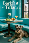 Miniature Schnauzer relaxing in a Tiffany blue café nook beside a table with cucumber sandwiches muffins a peach cocktail and a white flower in a glass vase